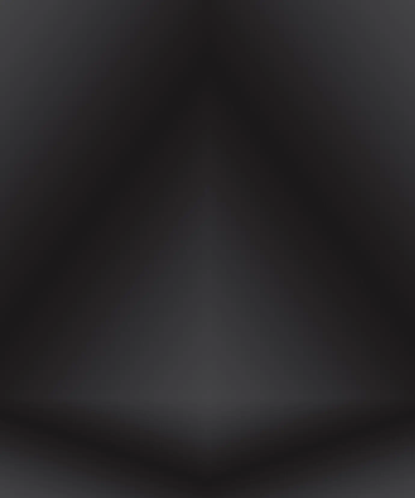 Abstrakter, luxuriöser, verschwommener Verlauf in Dunkelgrau und Schwarz, als Hintergrundwand im Studio zur Präsentation Ihrer Produkte.